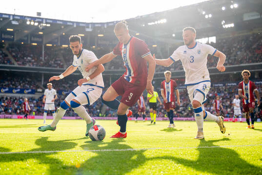 Leart Paqarada of Kosovo, Erling Braut Haaland of Norway