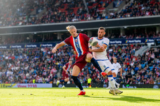 Erling Braut Haaland of Norway and Fidan Aliti of Kosovo