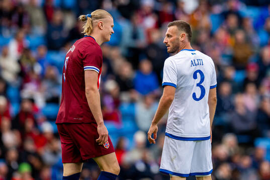 Erling Braut Haaland of Norway and Fidan Aliti of Kosovo