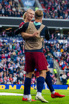 Erling Braut Haaland of Norway celebrates with teammate