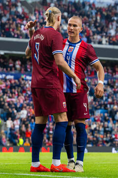 Erling Braut Haaland of Norway celebrates with teammate Leo