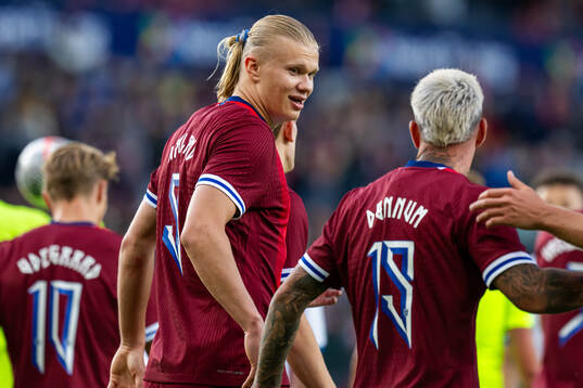 Erling Braut Haaland of Norway celebrates with teammate