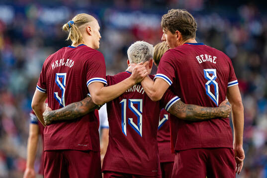 Erling Braut Haaland of Norway celebrates with teammates