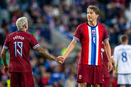 Aron Dønnum and Sander Berge of Norway celebrate