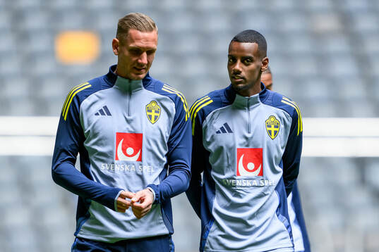 goalkeeper Robin Olsen and Alexander Isak of the Swedish