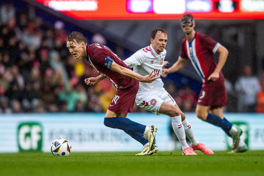 Martin Ødegaard of Norway and Mikkel Damsgaard of Denmark