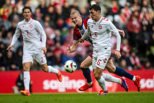 Erling Braut Haaland of Norway and Andreas Christensen of