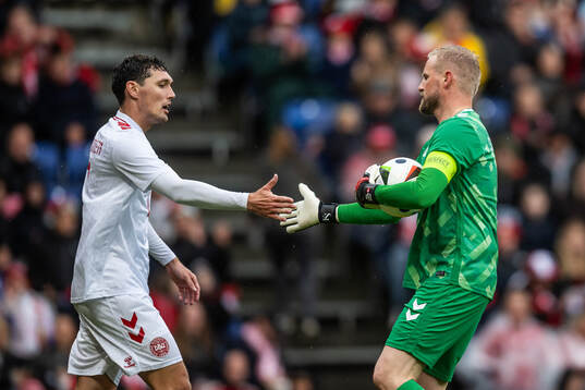 Andreas Christensen and goalkeeper Kasper Schmeichel of