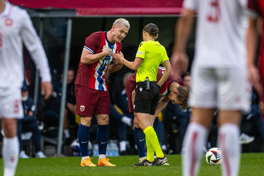 Julian Ryerson of Norway and referee Stéphanie Frappart