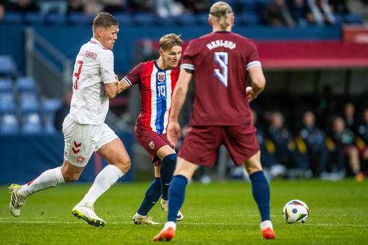 Jannik Vestergaard of Denmark and Martin Ødegaard of Norway