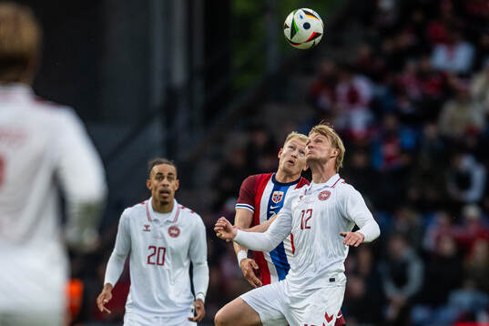 Andreas Hanche-Olsen of Norway and Kasper Dolberg of Denmark