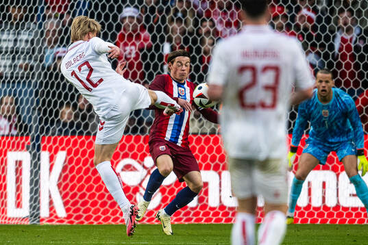 Kasper Dolberg of Denmark and Patrick Berg of Norway