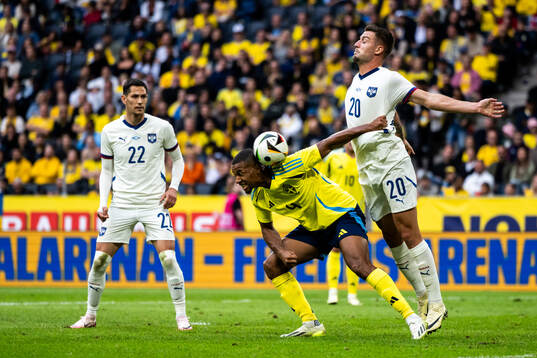 Isak Hien of Sweden and Sergej Milinkovic-Savic of Serbia