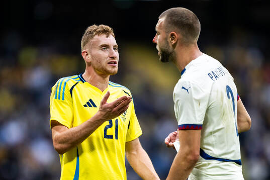 Dejan Kulusevski of Sweden and Strahinja Pavlovic of Serbia