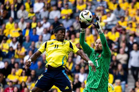 Anthony Elanga of Sweden  and goalkeeper Predrag Rajkovic