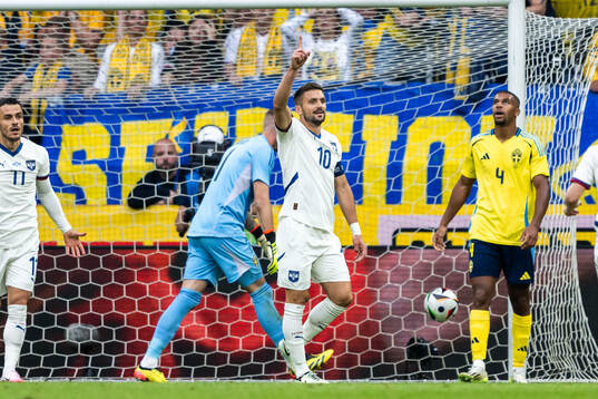 Dusan Tadic of Serbia celebrates