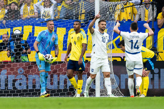Robin Olsen and Isak Hien of Sweden looks dejected
