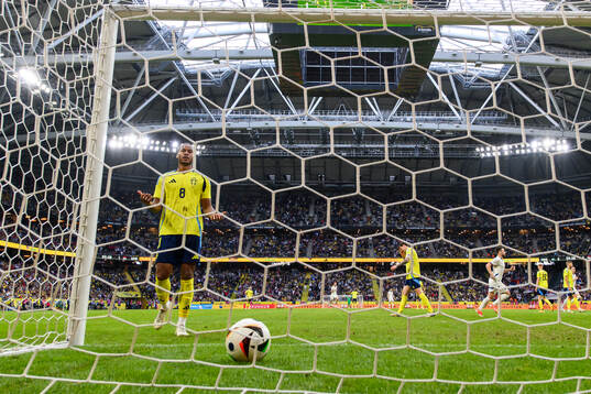 Jens-Lys Michel Cajuste of Sweden looks dejectdd