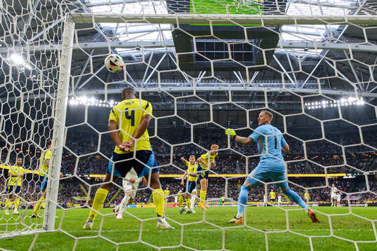 Isak Hien and goalkeeper Robin Olsen of Sweden as Dusan