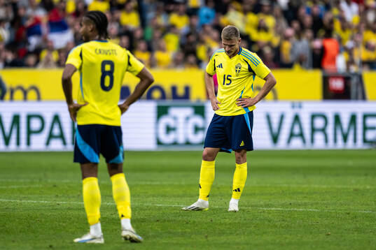 Jens-Lys Michel Cajuste and Carl Starfelt of Sweden look