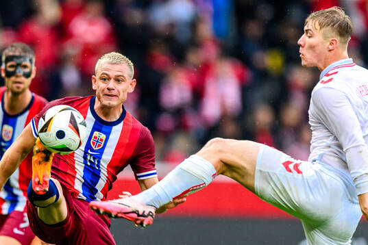 Julian Ryerson of Norway and Rasmus Højlund of Denmark