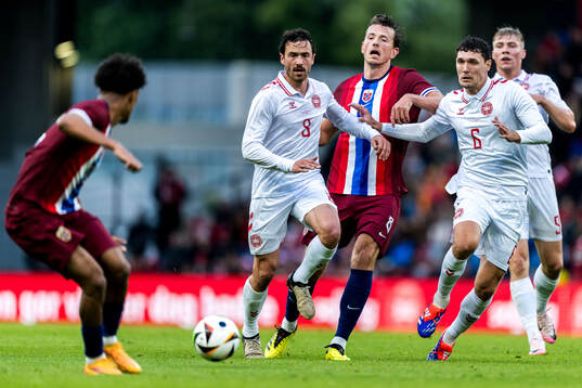 Thomas Delaney and Andreas Christensen of Denmark and