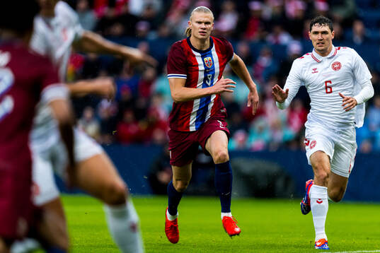 Erling Braut Haaland of Norway and Andreas Christensen of
