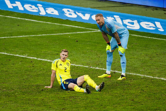 Emil Krafth and Robin Olsen of Sweden look dejected
