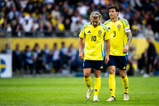 Emil Forsberg and Victor Nilsson Lindelöf of Sweden look