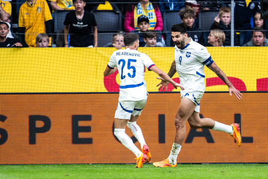 Filip Mladenovic and Aleksandar Mitrovic of Serbia celebrate