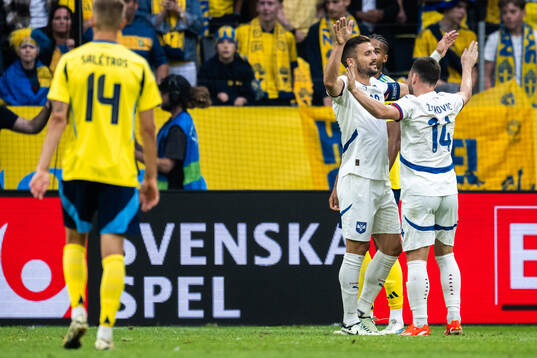 Dusan Tadic of Serbia celebrates