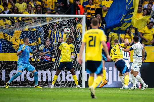Dusan Tadic of Serbia scores the 0-3 goal behind Isak Hien