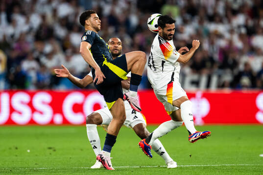 Che Adams of Scotland and Ilkay Gündogan of Germany