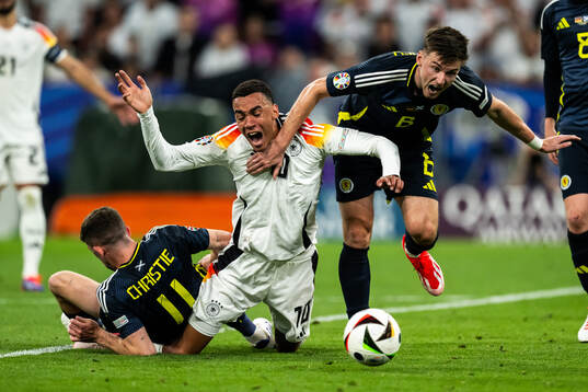 Ryan Christie and Kieran Tierney of Scotland against Jamal