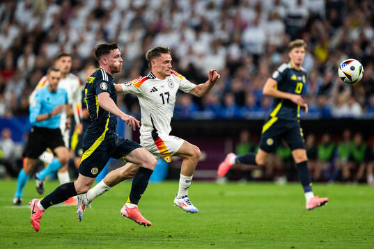 Andrew Robertson of Scotland and Florian Wirtz of Germany