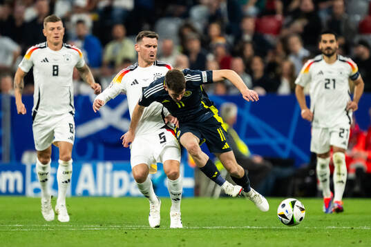 Pascal Gross of Germany and Ryan Christie of Scotland