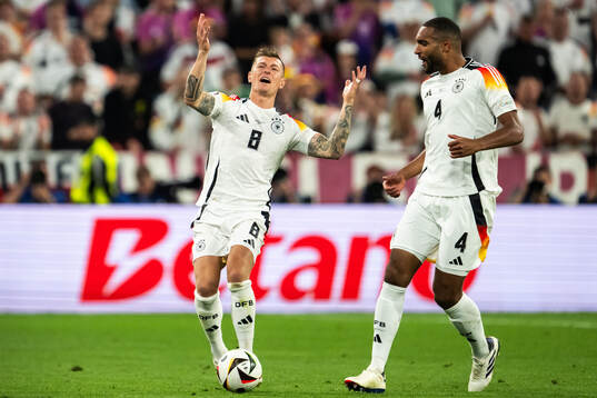Toni Kroos and Jonathan Tah of Germany