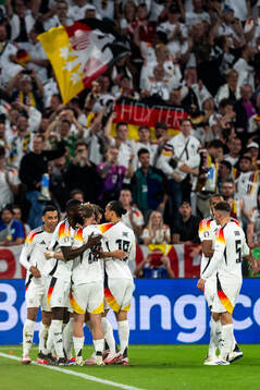 Niclas Füllkrug of Germany celebrate with teammates