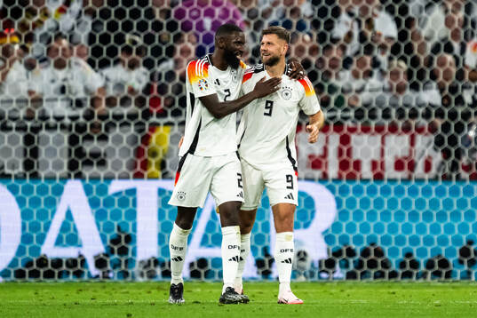 Niclas Füllkrug of Germany celebrate with Antonio Rüdiger