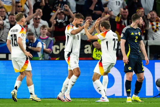 Niclas Füllkrug of Germany celebrate with Thomas Müller