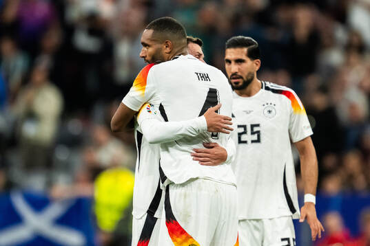 Pascal Gross and Jonathan Tah of Germany celebrate