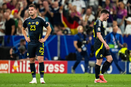 Kenny McLean and Kieran Tierney of Scotland looks dejected