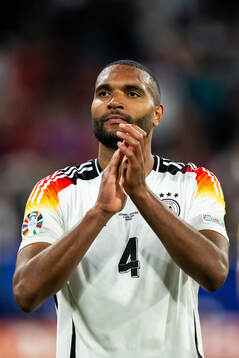 Jonathan Tah of Germany celebrates