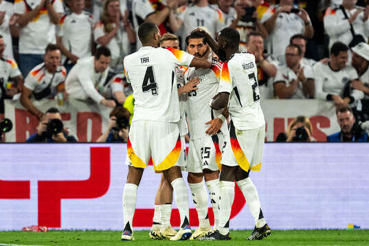 Emre Can of Germany celebrate with teammates