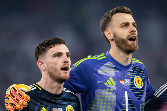 Andrew Robertson and goalkeeper Angus Gunn of Scotland