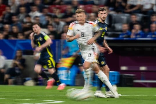 Toni Kroos of Germany and Ryan Christie of Scotland