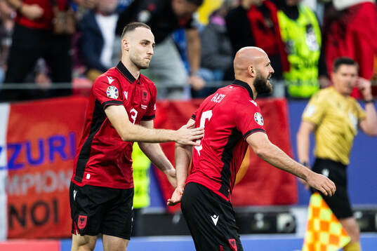 Mario Mitaj and Arlind Ajeti of Albania celebrate