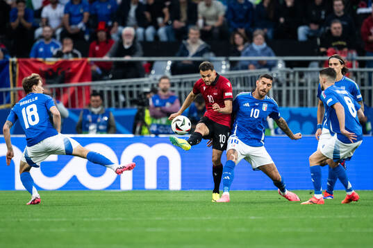 Nedim Bajrami of Albania and Lorenzo Pellegrini of Italy