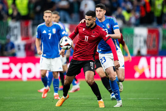 Armando Broja of Albania and Alessandro Bastoni of Italy