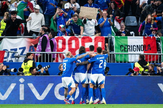 Alessandro Bastoni of Italy celebrates with team mates